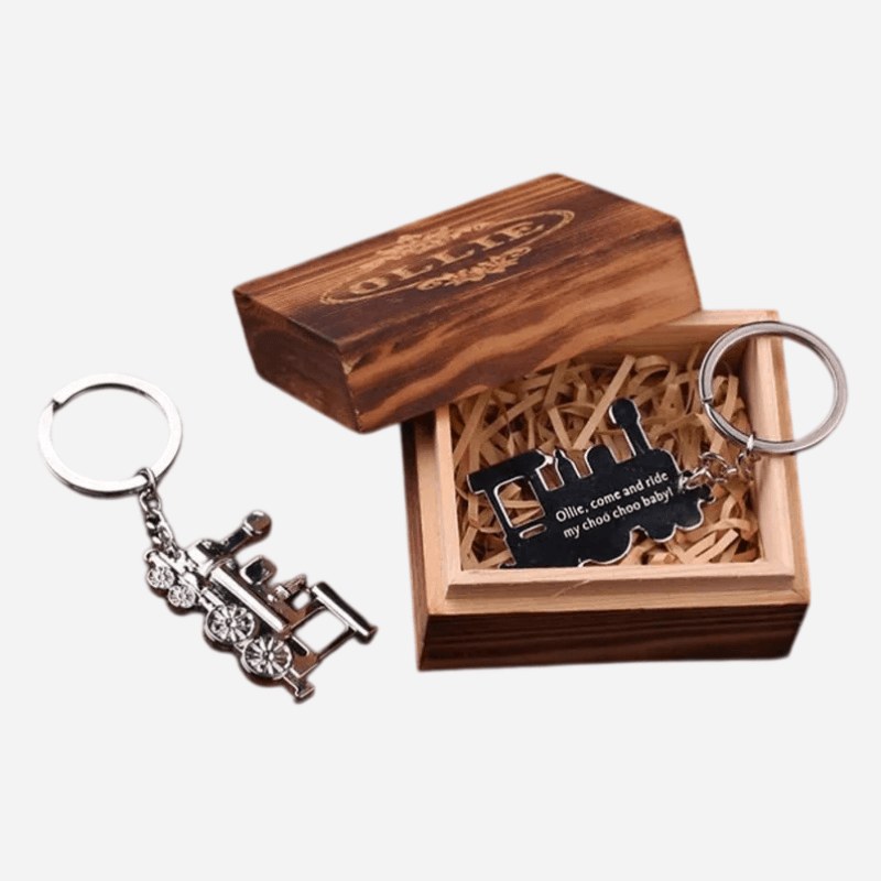 Vintage train keychain presented in a wooden gift box with a keepsake plate