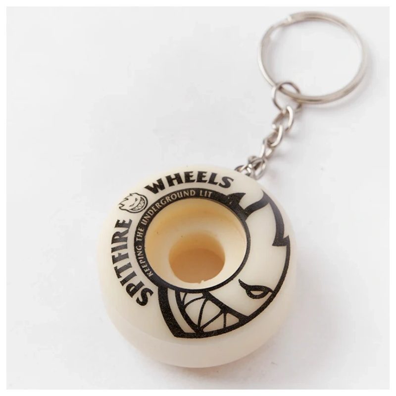 White spitfire wheel keychain close-up showing the printed sidewall and chain